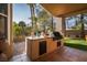 Outdoor kitchen and entertaining area with a built-in grill and plenty of counter space at 2108 Inverness Dr, Henderson, NV 89074