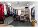 Organized walk-in closet with shelving, hanging rods, and tiled floors at 2108 Inverness Dr, Henderson, NV 89074