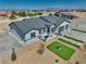 Aerial view of ranch house with desert landscaping and a small lawn featuring grass squares at 2650 Underbrush Ave, Pahrump, NV 89048