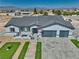 Aerial image showcasing the updated ranch house with mountain views and a desert landscaped lot at 2650 Underbrush Ave, Pahrump, NV 89048