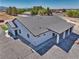 Aerial view showcasing a ranch-style home with a large tile roof and spacious gravel lot at 2650 Underbrush Ave, Pahrump, NV 89048