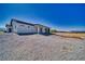 Expansive backyard featuring desert landscaping with a covered patio and potential for customization at 2650 Underbrush Ave, Pahrump, NV 89048