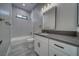 Bright bathroom featuring a combination tub/shower, granite countertop and modern vanity at 2650 Underbrush Ave, Pahrump, NV 89048