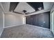 Large modern bedroom with statement wall and view to a walk in closet at 2650 Underbrush Ave, Pahrump, NV 89048