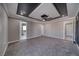 Large bedroom with coffered ceilings and access to a soaking tub and walk-in closet at 2650 Underbrush Ave, Pahrump, NV 89048