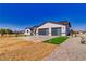Beautifully designed single-story home with a two-car garage and well-maintained front yard landscaping at 2650 Underbrush Ave, Pahrump, NV 89048