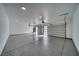 Spacious garage with epoxy flooring, automatic garage door openers, and white walls and ceiling at 2650 Underbrush Ave, Pahrump, NV 89048