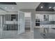 This view of the kitchen includes the pantry and a beverage fridge/bar area at 2650 Underbrush Ave, Pahrump, NV 89048