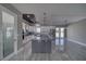 Modern kitchen features an island, stainless appliances, pantry and decorative backsplash at 2650 Underbrush Ave, Pahrump, NV 89048