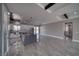 Bright kitchen with a large island, stainless appliances, and light gray tile flooring at 2650 Underbrush Ave, Pahrump, NV 89048