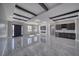 Spacious living room with recessed lighting, modern beams, a fireplace, and a wet bar at 2650 Underbrush Ave, Pahrump, NV 89048