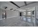 Bright living room featuring shiny tile flooring, modern beams, a fireplace, and a wet bar at 2650 Underbrush Ave, Pahrump, NV 89048