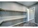 Spacious walk-in closet with built-in shelving and ample storage space for an organized wardrobe at 2650 Underbrush Ave, Pahrump, NV 89048
