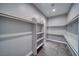 Spacious walk-in closet with shelving, gray walls and carpeting at 2650 Underbrush Ave, Pahrump, NV 89048