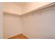 Walk-in closet with a sturdy clothing rack, neutral walls and tile flooring at 2696 Matogroso Ln, Las Vegas, NV 89121