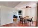 Cozy dining area with hardwood floors, a ceiling fan, and natural light at 2696 Matogroso Ln, Las Vegas, NV 89121