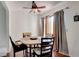 Inviting dining room with a round table, natural light, and hardwood floors at 2696 Matogroso Ln, Las Vegas, NV 89121