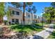 A lovely outdoor space showcasing well-maintained lawns and shade trees at 2696 Matogroso Ln, Las Vegas, NV 89121