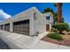 The home features a well-kept garage, tidy landscaping, and a stylish front door at 2696 Matogroso Ln, Las Vegas, NV 89121