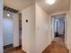 Hallway featuring closet, brown carpet and doors that lead to different areas of the home at 2696 Matogroso Ln, Las Vegas, NV 89121