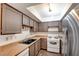 Kitchen with laminate countertops, a stainless steel refrigerator, and ample cabinet space at 2696 Matogroso Ln, Las Vegas, NV 89121