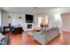 Bright living room with a fireplace, hardwood floors, and a comfortable sofa at 2696 Matogroso Ln, Las Vegas, NV 89121
