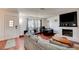 Inviting living room with a fireplace, natural light, and comfortable seating at 2696 Matogroso Ln, Las Vegas, NV 89121