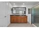 Bathroom features a double vanity, a large mirror, and a glass-enclosed shower at 2832 Aragon Terrace Way, Henderson, NV 89044