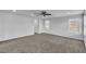 Large bedroom with neutral paint and carpet, ceiling fan, and bright windows at 2832 Aragon Terrace Way, Henderson, NV 89044