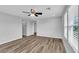 Bedroom features wood floors, ceiling fan, and natural light at 2832 Aragon Terrace Way, Henderson, NV 89044