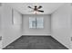 Clean bedroom with ceiling fan, carpeted floor, and view of a bright window at 2832 Aragon Terrace Way, Henderson, NV 89044