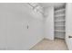 Walk-in closet with shelves and tile floor at 2832 Aragon Terrace Way, Henderson, NV 89044