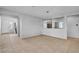 Open concept dining room featuring tile floors, neutral decor, and access to the staircase near the front door at 2832 Aragon Terrace Way, Henderson, NV 89044