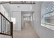 Spacious foyer featuring tile flooring and a staircase leading to the upper level, with natural light throughout at 2832 Aragon Terrace Way, Henderson, NV 89044