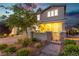 Welcoming front entrance with stone accents, a brick walkway, and mature landscaping at 2832 Aragon Terrace Way, Henderson, NV 89044
