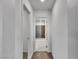 Bright hallway leads to a bathroom with a tile floor and shower at 2832 Aragon Terrace Way, Henderson, NV 89044