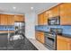 Modern kitchen featuring stainless steel appliances, granite countertops, and stylish cabinetry at 2832 Aragon Terrace Way, Henderson, NV 89044