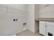 Functional laundry room with shelving, storage, and washer/dryer hookups at 2832 Aragon Terrace Way, Henderson, NV 89044