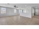 Large living room with tiled floors and a modern chandelier at 2832 Aragon Terrace Way, Henderson, NV 89044