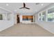 Open concept living room with tile floors and large windows at 2832 Aragon Terrace Way, Henderson, NV 89044