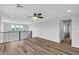 Well-lit loft space with hardwood flooring, railing, and windows at 2832 Aragon Terrace Way, Henderson, NV 89044