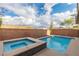 Backyard pool and spa area, surrounded by brick wall, offering privacy and relaxation at 2832 Aragon Terrace Way, Henderson, NV 89044