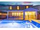 Exterior showcasing a tranquil pool, covered patio, and landscaped yard for outdoor enjoyment at 2832 Aragon Terrace Way, Henderson, NV 89044