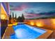 A serene outdoor swimming pool and jacuzzi offer a refreshing escape with landscaped surroundings at 2832 Aragon Terrace Way, Henderson, NV 89044