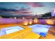 Beautiful pool and spa with brick surround under a stunning night sky at 2832 Aragon Terrace Way, Henderson, NV 89044