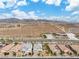 Scenic street view featuring single-Gathering homes against a mountainous desert backdrop at 2832 Aragon Terrace Way, Henderson, NV 89044