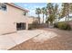 Spacious backyard featuring rock landscaping, a concrete patio, and mature trees for shade and privacy at 2874 Avanti Ln, Henderson, NV 89074