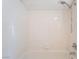 Bright white tiled shower and bathtub with chrome fixtures at 2874 Avanti Ln, Henderson, NV 89074