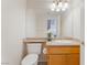 Cozy bathroom featuring a large mirror, a white sink, and neutral-toned countertops at 2874 Avanti Ln, Henderson, NV 89074