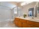 Bright bathroom featuring double sink vanity, shower and bathtub with window at 2874 Avanti Ln, Henderson, NV 89074